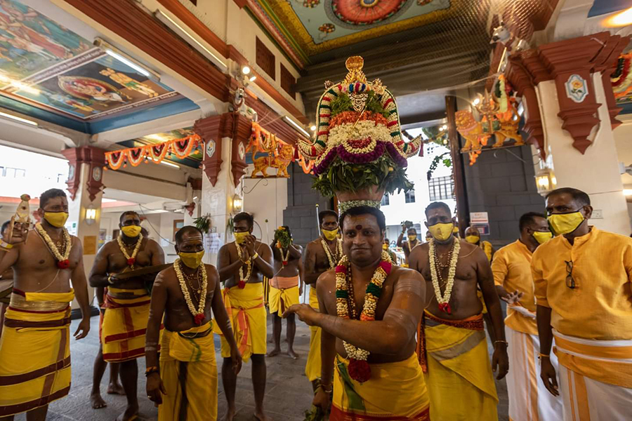 The completed Karagam sits on the head of the Chief Pandaram of Sri Mariamman Temple, as he performs the ritual Karagattam dance for Theemithi. Credits: Hindu Endowments Board.