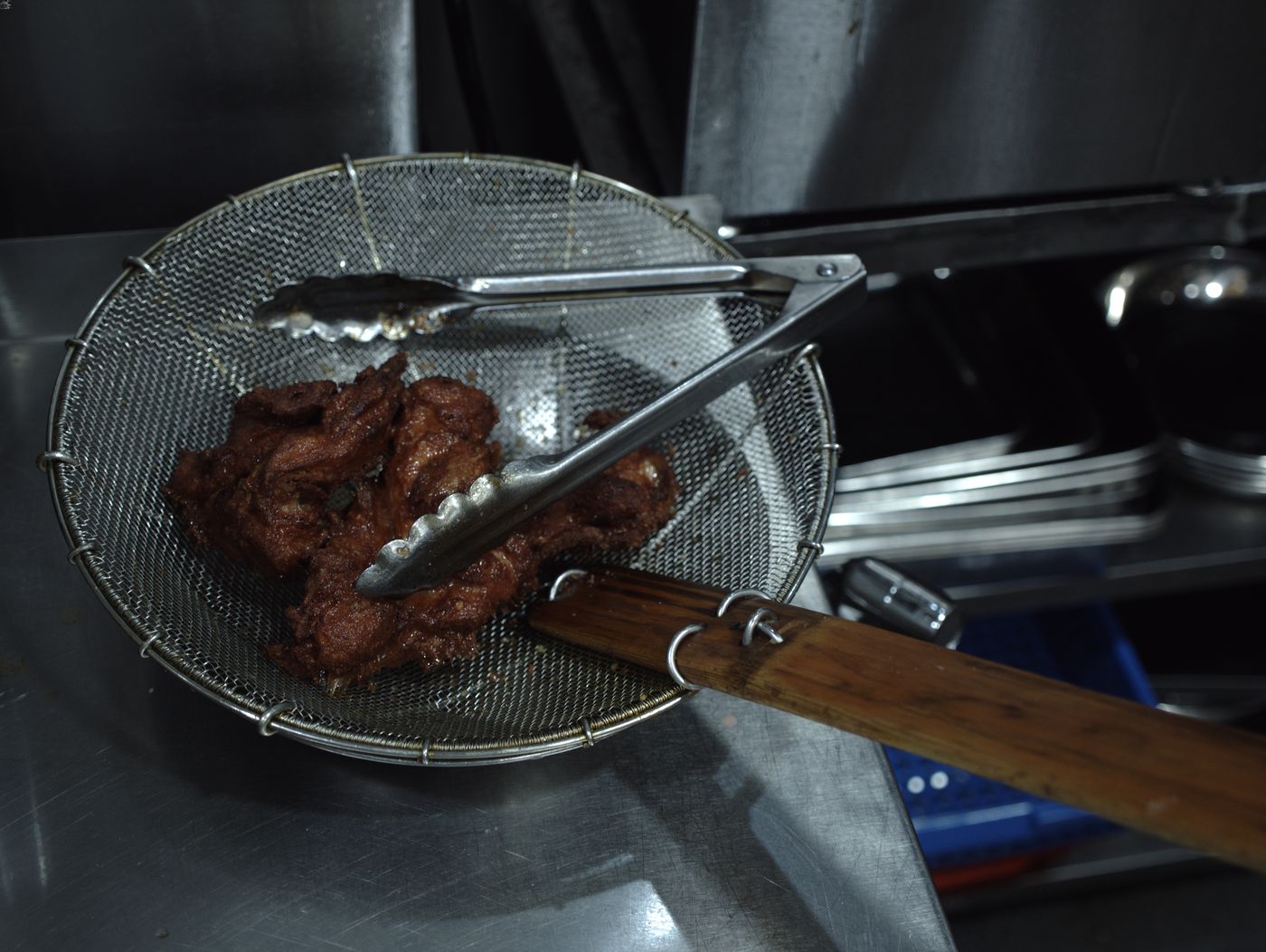 The fried pork chop is a key component of a Hainanese curry rice dish.