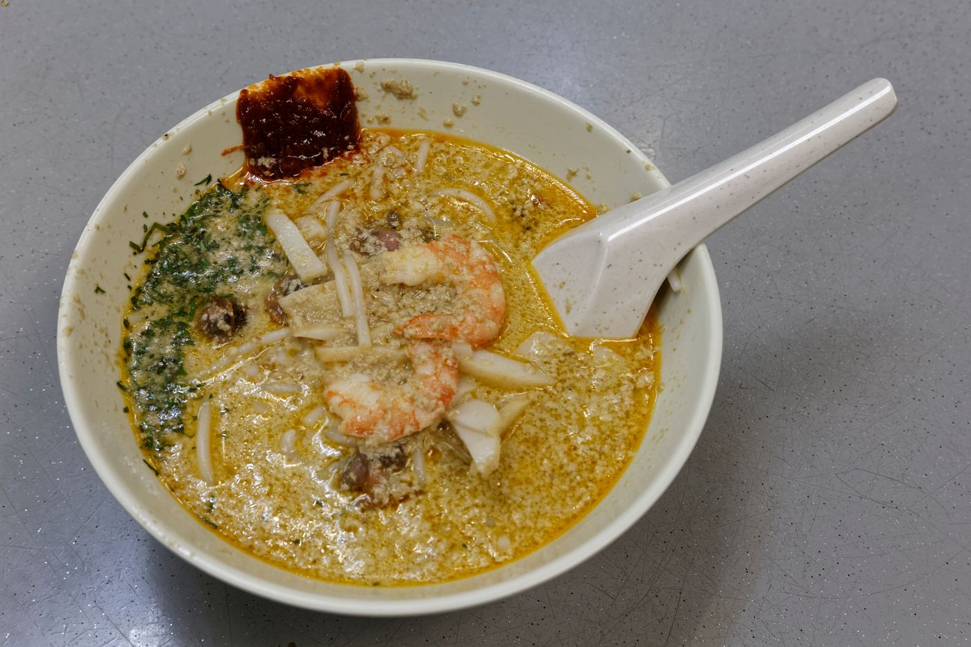 A bowl of laksa from a stall in Katong, where many laksa stalls are located.