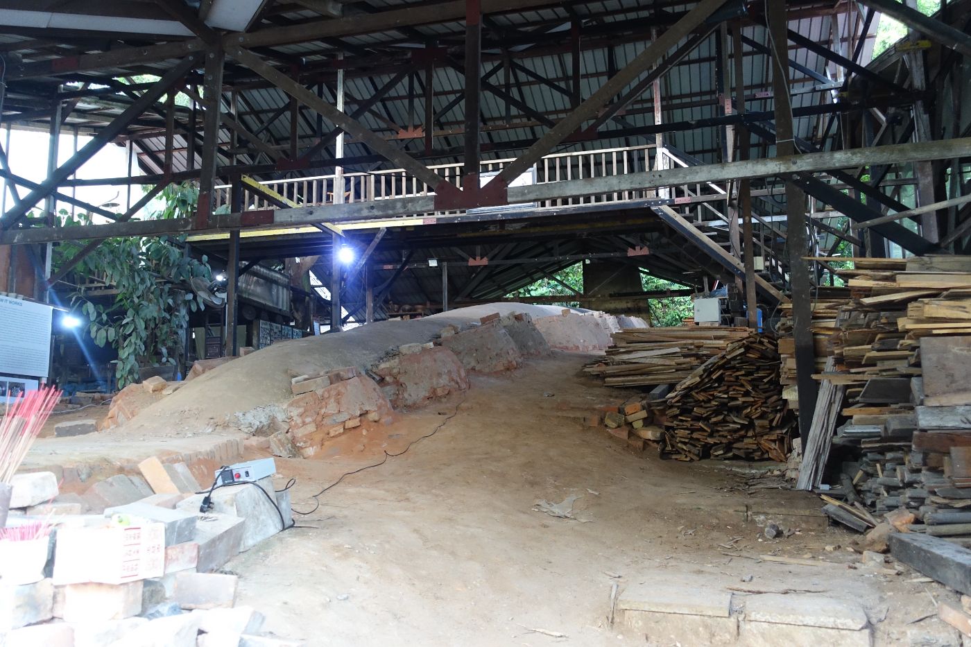 A dragon kiln comprises a long firing chamber built on a slope with many stoke holes on the side.  Shown here is the Thow Kwang Dragon Kiln, the only functioning dragon kiln in Singapore today.