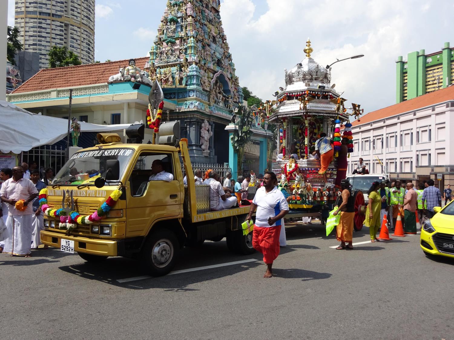 In Singapore, the silver chariot – a huge processional cart carrying an image or idol of the festival’s presiding deity – is towed along a public route for worshippers.