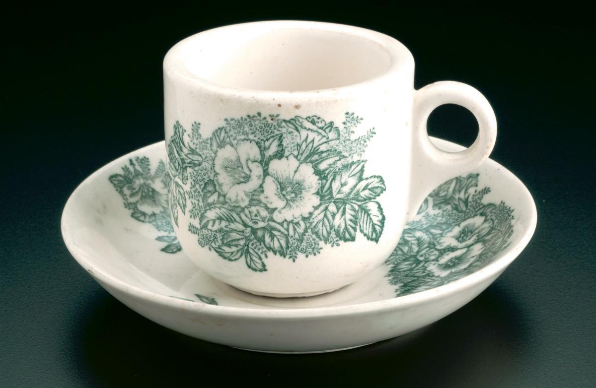 Kopitiam cup and saucer with dark green 'bunga raya' (hibiscus) motif