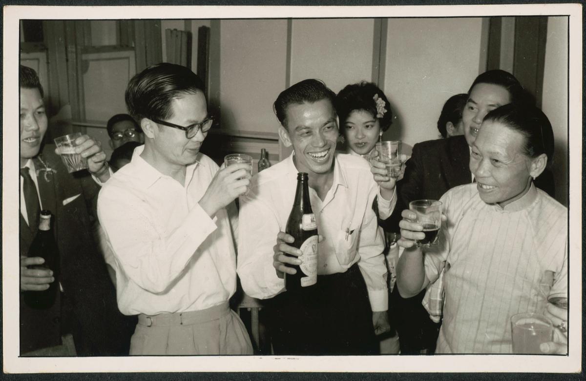 Guests offering a toast at a wedding dinner