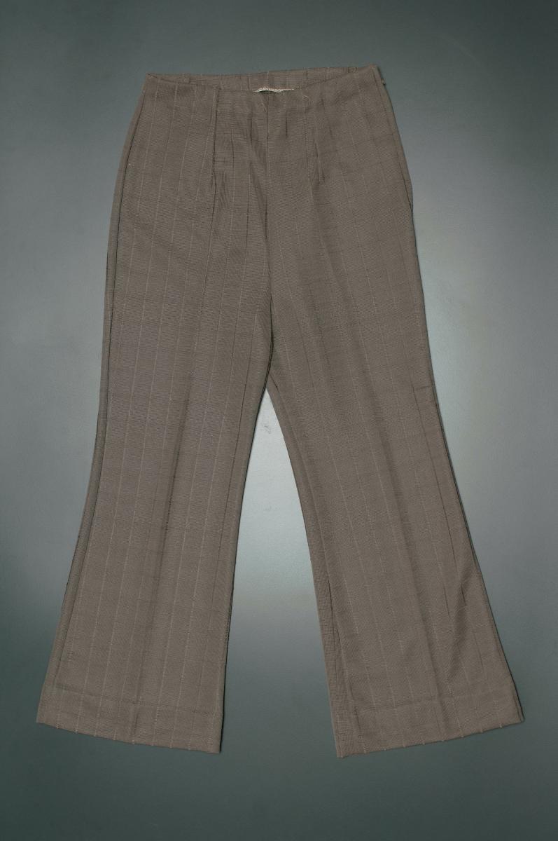 A pair of brown nylon jersey bell-bottom pants