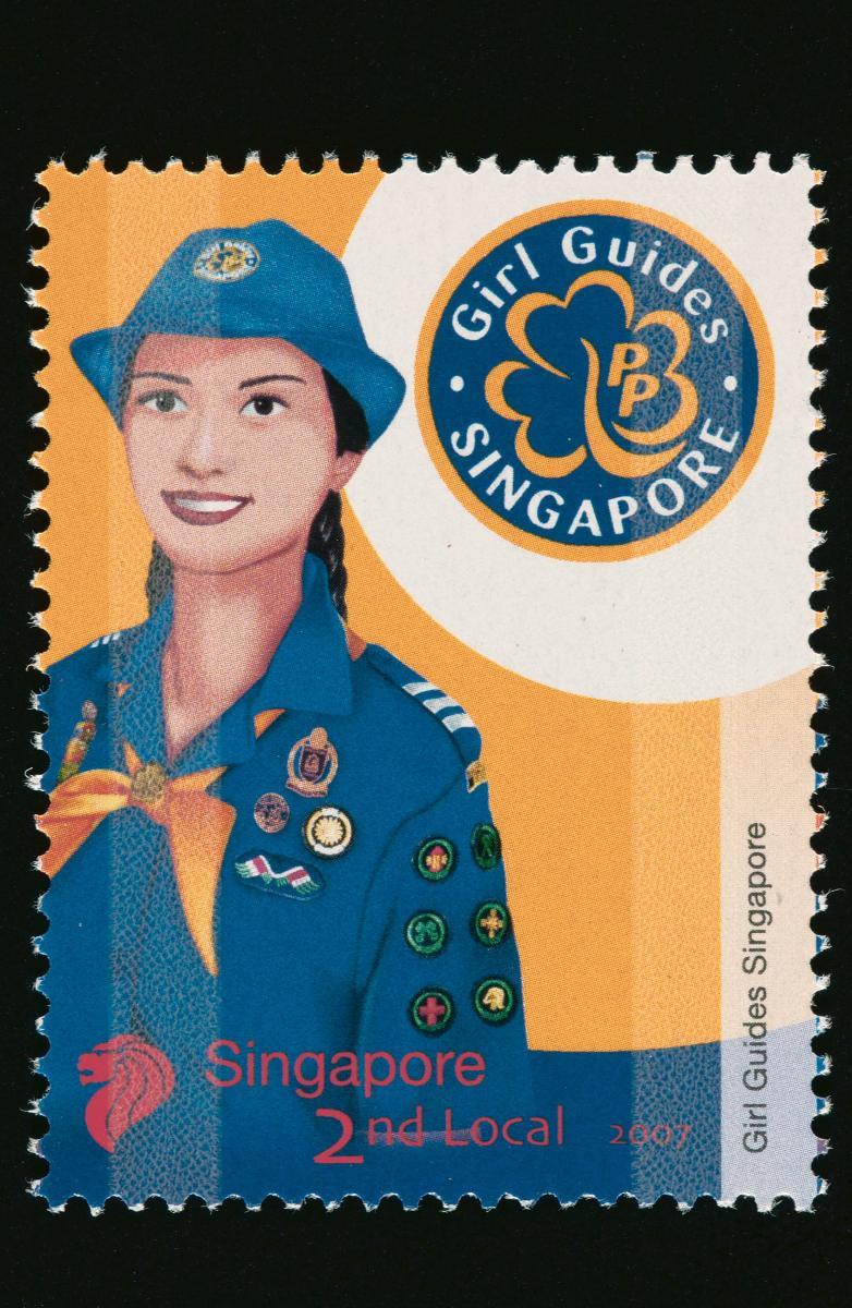 Stamp featuring the Girl Guides Singapore uniform