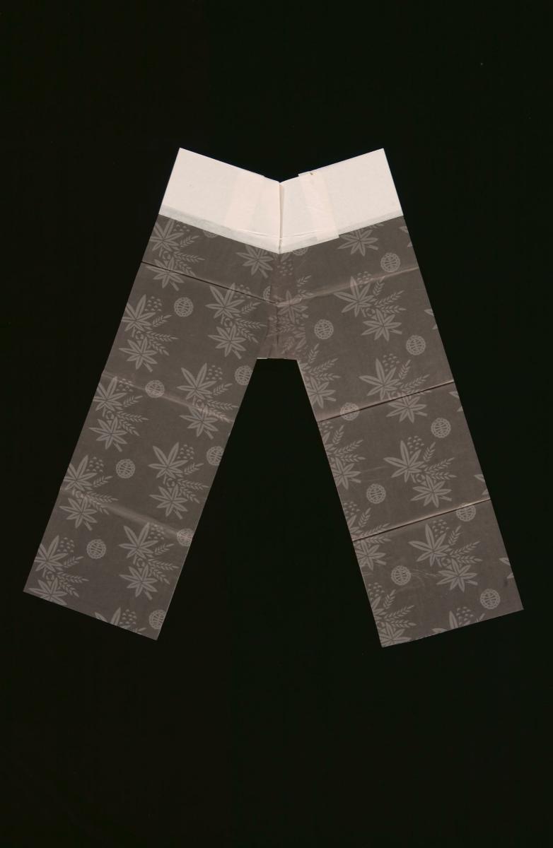 A pair of grey paper pants with floral prints