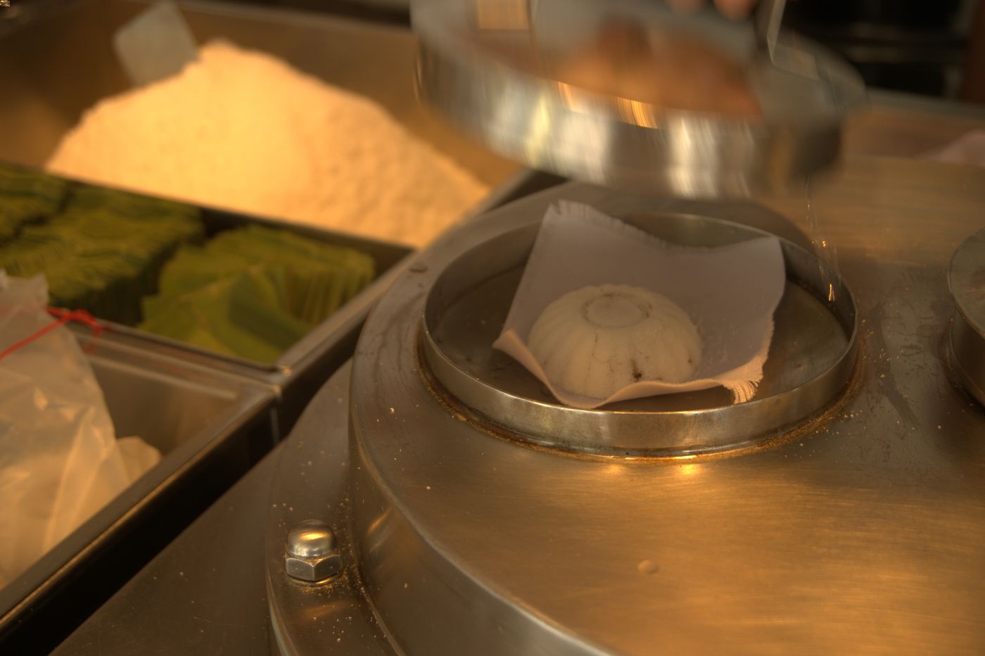 Kueh tutu is a steamed rice-cake snack that is commonly sold in Singapore.