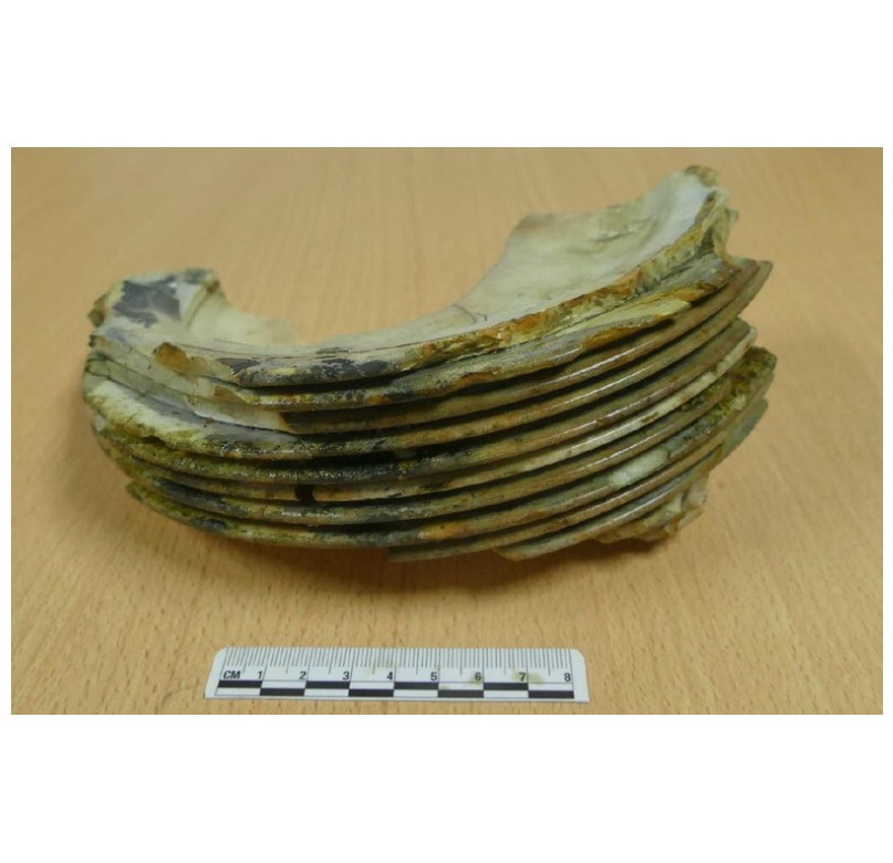 <em>Stack of plates – the glaze has melted in the fire, sticking the plates together.</em>